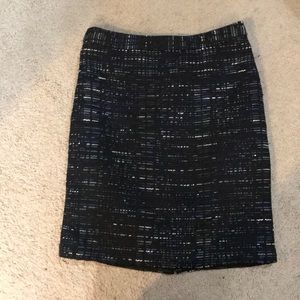 Patterned black pencil skirt with detailing